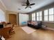 Bedroom featuring three windows, plantation shutters, a daybed, and a wall of storage at 907 Pawstand Rd, Celebration, FL 34747