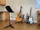 Bonus room featuring multiple guitars, a ukulele and guitar stand at 907 Pawstand Rd, Celebration, FL 34747