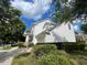 Charming two-story home with white siding, front porch, and well-maintained landscaping at 907 Pawstand Rd, Celebration, FL 34747