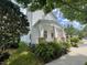 Charming two-story home with a cozy front porch and lush green lawn at 907 Pawstand Rd, Celebration, FL 34747