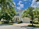 Inviting two-story home featuring a front porch, attached garage, and well-maintained landscaping at 907 Pawstand Rd, Celebration, FL 34747