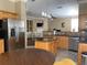 Spacious kitchen with stainless steel refrigerator and adjacent breakfast nook at 907 Pawstand Rd, Celebration, FL 34747
