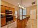 Modern kitchen with granite island, stainless steel appliances and breakfast area at 907 Pawstand Rd, Celebration, FL 34747