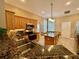 Well-equipped kitchen features granite countertops, stainless steel appliances, and a functional center island at 907 Pawstand Rd, Celebration, FL 34747