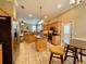 Open kitchen with stainless steel appliances, granite countertops, and a breakfast nook at 907 Pawstand Rd, Celebration, FL 34747