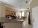 Well-lit kitchen featuring granite countertops and stainless steel appliances at 907 Pawstand Rd, Celebration, FL 34747