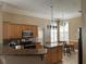 Open kitchen with granite counters, stainless appliances, and an eat-in kitchen at 907 Pawstand Rd, Celebration, FL 34747