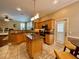 Open kitchen featuring stainless steel appliances, granite counters, and a breakfast area at 907 Pawstand Rd, Celebration, FL 34747