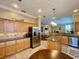 Expansive kitchen with granite counters, stainless appliances, and a breakfast area at 907 Pawstand Rd, Celebration, FL 34747