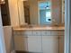Bathroom featuring double sinks, spacious granite countertops, and modern cabinetry at 9938 Eagle Creek Center Blvd, Orlando, FL 32832