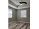 This bedroom has a ceiling fan and two windows at 9938 Eagle Creek Center Blvd, Orlando, FL 32832