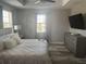 Bright bedroom featuring a ceiling fan and large window at 9938 Eagle Creek Center Blvd, Orlando, FL 32832