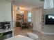 Cozy dining area features a modern chandelier and round table with seating for four at 9938 Eagle Creek Center Blvd, Orlando, FL 32832