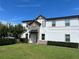Well-maintained two-story home with manicured lawn and stone detailing, providing a pleasant exterior view at 9938 Eagle Creek Center Blvd, Orlando, FL 32832