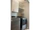 Modern laundry room featuring a washer and dryer with white cabinets at 9938 Eagle Creek Center Blvd, Orlando, FL 32832