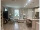 Open-concept living room with neutral tones, stylish decor and modern furniture at 9938 Eagle Creek Center Blvd, Orlando, FL 32832