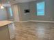 Open-concept living area with tile floors, light gray walls, and natural light, perfect for modern living at 9938 Eagle Creek Center Blvd, Orlando, FL 32832
