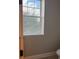 Compact powder room features a toilet and a window at 9938 Eagle Creek Center Blvd, Orlando, FL 32832