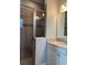 The bathroom showcases a sliding glass shower door with elegant tile at 9938 Eagle Creek Center Blvd, Orlando, FL 32832