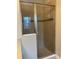 Shower with glass doors and tile surround at 9938 Eagle Creek Center Blvd, Orlando, FL 32832