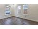 Bedroom featuring new laminate flooring, fresh paint, and natural light at 1007 11Th St, St Cloud, FL 34769