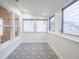 Sunroom with beautiful patterned tile floor, white walls, and lots of natural light at 1007 11Th St, St Cloud, FL 34769