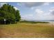 Picturesque lake view property featuring lush greenery and serene waterfront access at 1007 11Th St, St Cloud, FL 34769