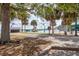 Community splash pad with water features and shade trees, adjacent to a walking path at 1007 11Th St, St Cloud, FL 34769