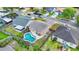 Aerial view of a home showcasing a backyard swimming pool and a fenced yard in a residential neighborhood at 1050 Dees Dr, Oviedo, FL 32765