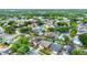 A residential neighborhood from above; the homes have neat lawns and leafy trees at 1050 Dees Dr, Oviedo, FL 32765