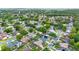 An aerial view of a neighborhood with many trees and well-maintained homes on neatly aligned streets at 1050 Dees Dr, Oviedo, FL 32765
