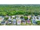 An aerial shot of a neighborhood showcasing many homes and a dense, lush forest in the background at 1050 Dees Dr, Oviedo, FL 32765