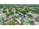An aerial view of a quiet residential neighborhood with mature trees and well-maintained homes at 1050 Dees Dr, Oviedo, FL 32765