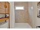 Bathroom showcasing subway tile shower over tub with a small window, white shower curtain, and bamboo shelving at 1050 Dees Dr, Oviedo, FL 32765