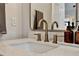 A detailed view of a bathroom sink with a quartz countertop and modern fixtures, complemented by neutral decor at 1050 Dees Dr, Oviedo, FL 32765