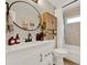 Stylish bathroom with a modern vanity, an oval mirror, and a shower-tub combination at 1050 Dees Dr, Oviedo, FL 32765