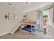 bedroom featuring a bunk bed with slide, complemented by light-colored walls and a window with natural light at 1050 Dees Dr, Oviedo, FL 32765