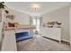 A delightful bedroom featuring a bunk bed with a slide and white furniture against neutral colored walls and carpet at 1050 Dees Dr, Oviedo, FL 32765