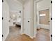 View of a primary bedroom featuring a bed, ensuite bathroom, and neutral decor creating a serene and inviting atmosphere at 1050 Dees Dr, Oviedo, FL 32765
