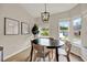 Cozy dining room with a modern chandelier, stylish decor, and ample natural light at 1050 Dees Dr, Oviedo, FL 32765