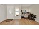 Bright entryway featuring wood-look floors and an adjacent home office area at 1050 Dees Dr, Oviedo, FL 32765