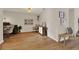 Well-lit entryway highlighting wood-look floors, home office space, and decorative accents at 1050 Dees Dr, Oviedo, FL 32765