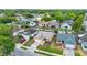 An aerial view of a one-story home featuring a manicured lawn, a driveway, and neighborhood views at 1050 Dees Dr, Oviedo, FL 32765