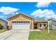 Charming single-story home featuring a two-car garage, and well-maintained landscaping at 1050 Dees Dr, Oviedo, FL 32765