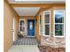 Charming front porch with stylish tiling, decorative lighting, and comfortable seating at 1050 Dees Dr, Oviedo, FL 32765