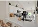 Bright kitchen with stainless steel appliances, quartz countertops, and a breakfast bar at 1050 Dees Dr, Oviedo, FL 32765