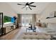 Comfortable living room with modern furnishings, a large TV, and sliding doors to the pool at 1050 Dees Dr, Oviedo, FL 32765