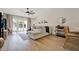 Inviting living room with a comfortable sectional, neutral tones, and access to the outdoor area at 1050 Dees Dr, Oviedo, FL 32765