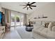 Bright living room with vaulted ceilings, a large sectional sofa, and views of the pool at 1050 Dees Dr, Oviedo, FL 32765