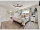 Serene main bedroom with plush carpeting, neutral décor, and an en-suite bathroom at 1050 Dees Dr, Oviedo, FL 32765